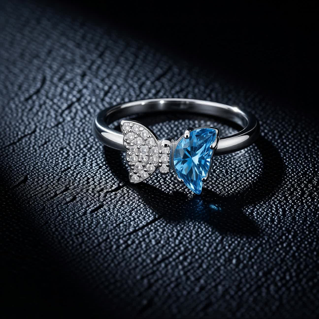 Bow Accent Ring – Sterling Silver with Blue Crystal & Pavé Details