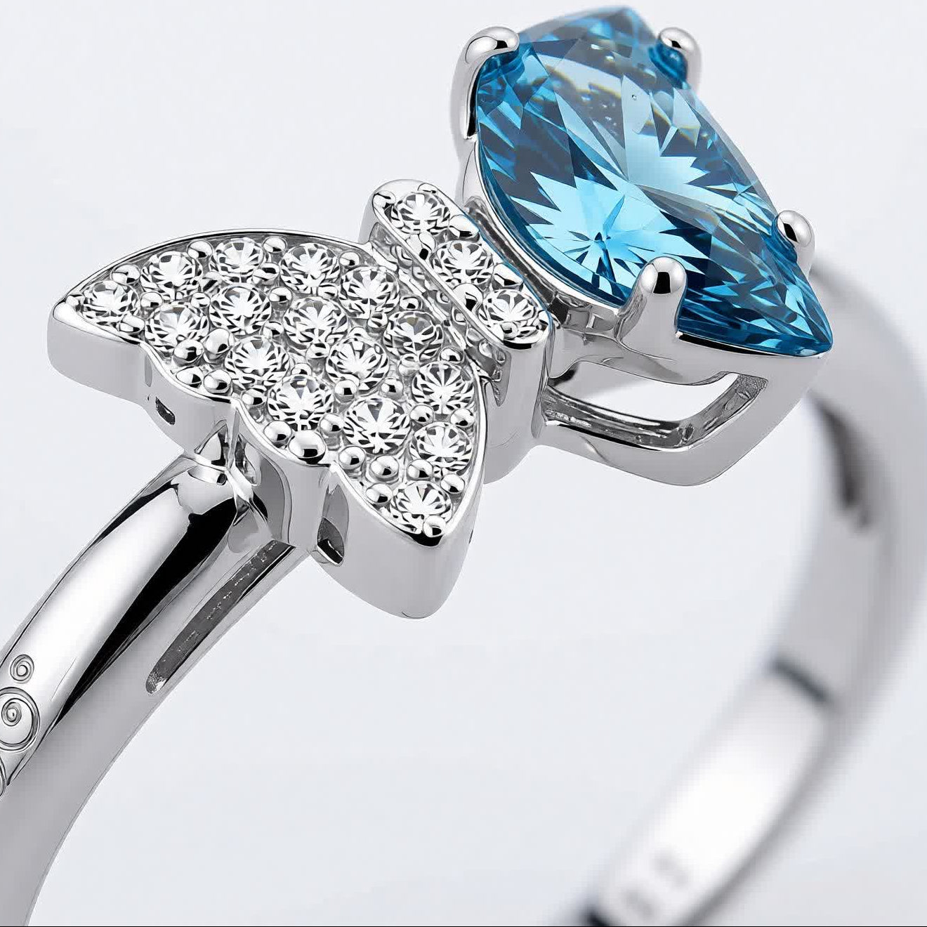 Bow Accent Ring – Sterling Silver with Blue Crystal & Pavé Details