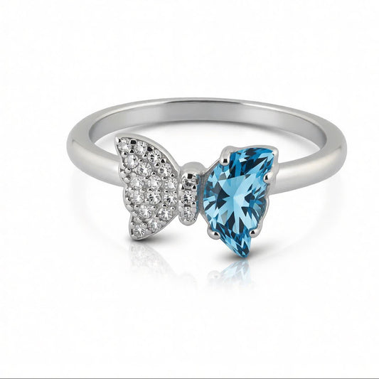 Bow Accent Ring – Sterling Silver with Blue Crystal & Pavé Details